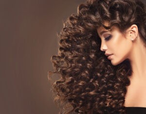 Brunette,Girl,With,Long,And,Shiny,Curly,Hair,.,Beautiful